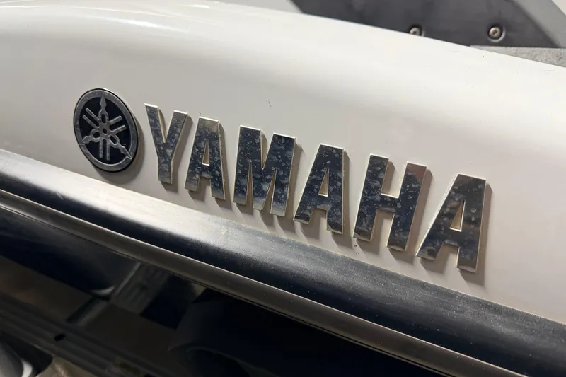 Slide: The Image of Close-up of 2015 Yamaha WaveRunner FX Cruiser HO logo on white surface. - 18
