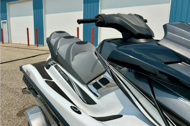 Slide: The Image of 2015 Yamaha WaveRunner FX Cruiser HO jet ski, parked near blue building. - 6