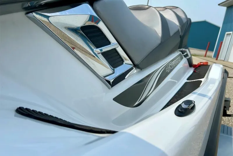 Slide: The Image of 2015 Yamaha WaveRunner FX Cruiser HO, close-up of sleek seat and chrome detailing. - 9