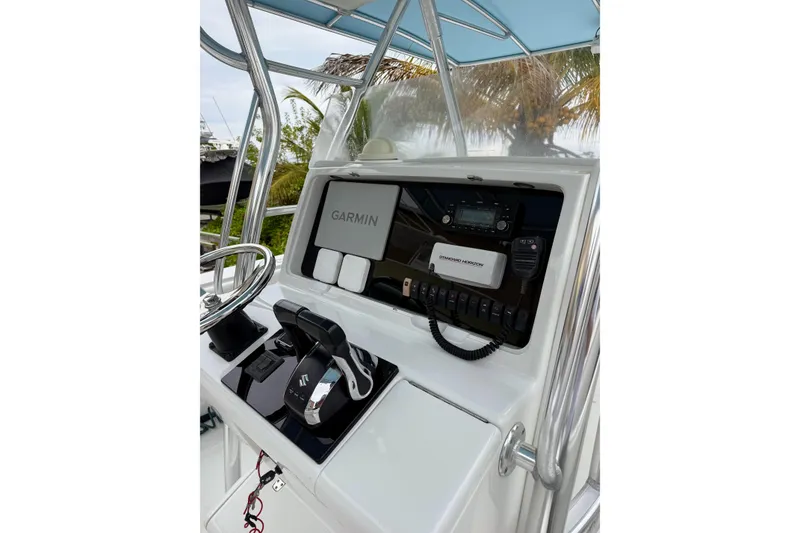 Slide: The Image of 2005 Jupiter 31 Center Console boat dashboard with Garmin navigation system and controls. - 5