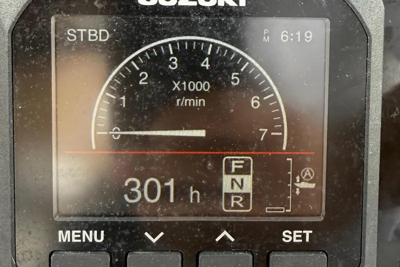 Slide: The Image of Suzuki engine display showing 301 hours on Jupiter 31 Center Console. - 9