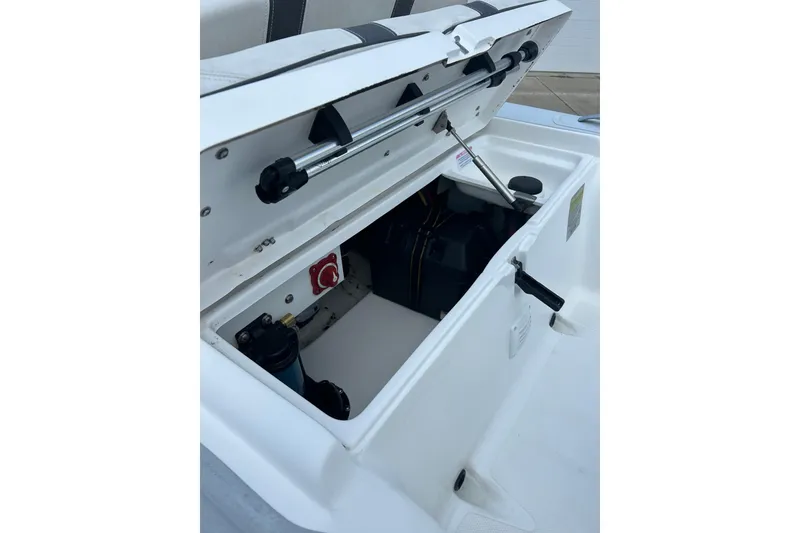 Slide: The Image of Open storage compartment of 2018 AB Inflatables Oceanus 4.30VSC boat, showing interior components. - 13