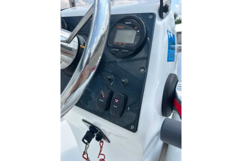 Slide: The Image of 2018 AB Inflatables Oceanus 4.30VSC dashboard with steering wheel and control panel. - 19