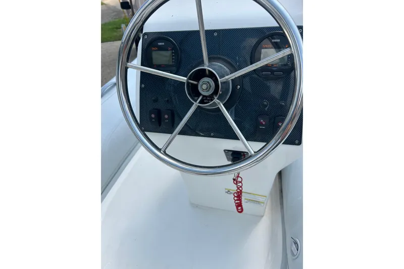 Slide: The Image of Steering console of 2018 AB Inflatables Oceanus 4.30VSC boat with gauges and controls. - 22