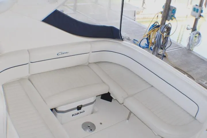 Slide: The Image of White Igloo cooler under seat on 2002 Bayliner 3055 Ciera boat. - 15