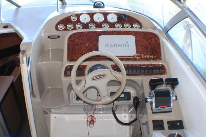Slide: The Image of Interior view of a 2002 Bayliner 3055 Ciera boat cockpit with seating and console. - 18