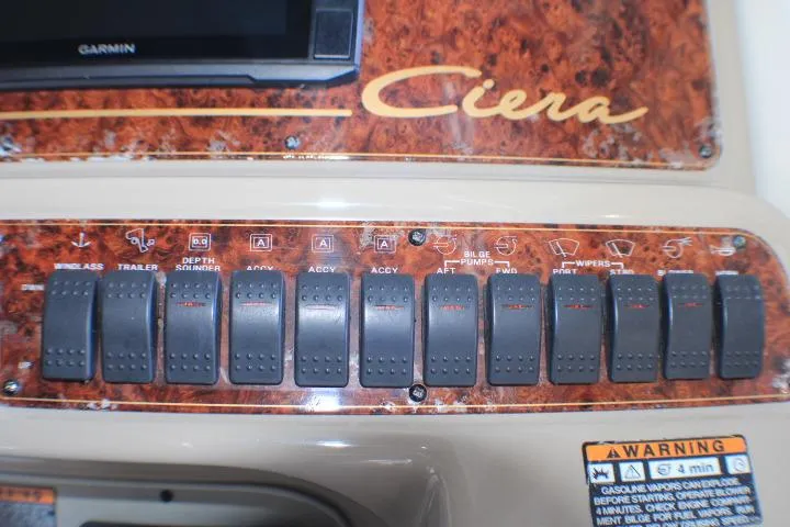 Slide: The Image of Dashboard of a 2002 Bayliner 3055 Ciera boat with gauges and controls. - 23