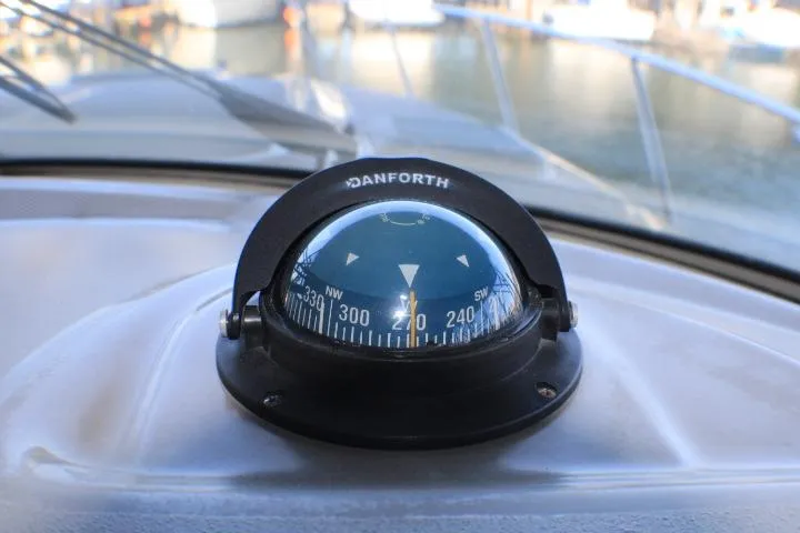 Slide: The Image of Control panel of a 2002 Bayliner 3055 Ciera boat with labeled switches. - 24