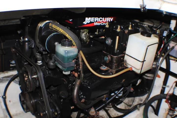 Slide: The Image of Engine compartment of a 2002 Bayliner 3055 Ciera boat, featuring a MerCruiser engine. - 29