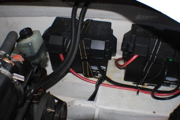 Slide: The Image of Engine compartment of a 2002 Bayliner 3055 Ciera with wiring and fluid reservoirs visible. - 31