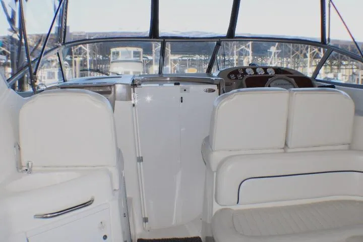 Slide: The Image of Electrical control panel on a 2002 Bayliner 3055 Ciera boat, featuring switches and a warning label. - 33