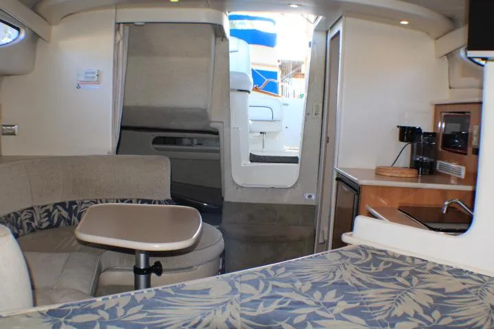 Slide: The Image of Interior of 2002 Bayliner 3055 Ciera boat with cozy cabin and dining area. - 36
