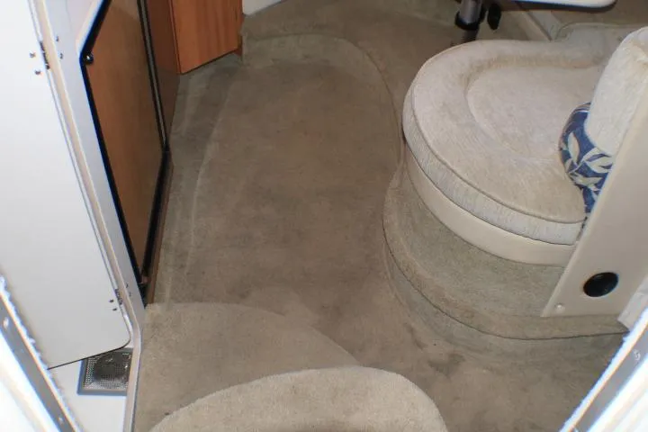 Slide: The Image of Interior of 2002 Bayliner 3055 Ciera boat with seating, table, and kitchenette. - 37