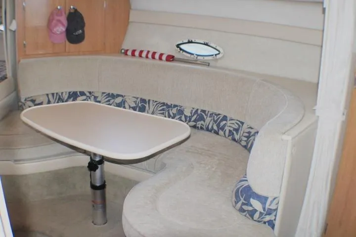 Slide: The Image of Interior steps of a 2002 Bayliner 3055 Ciera boat, featuring beige carpeting. - 39