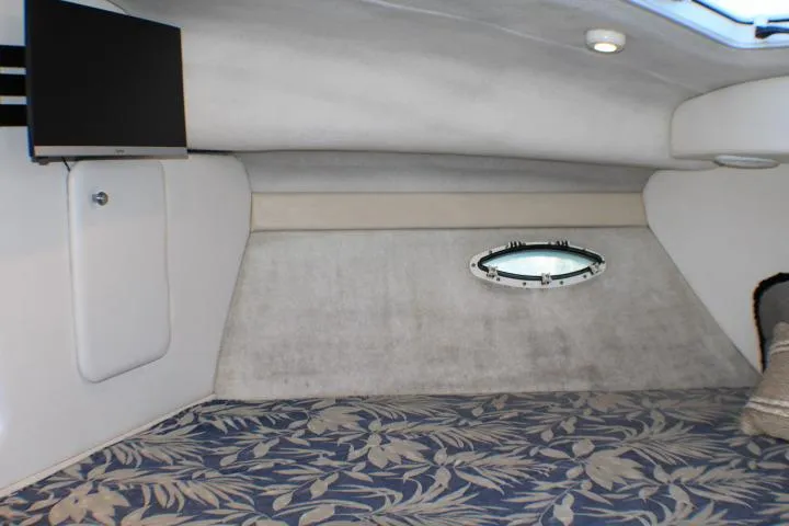 Slide: The Image of Cozy cabin interior of 2002 Bayliner 3055 Ciera with floral bedding and pillows. - 46