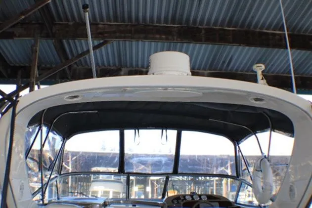 Slide: The Image of 2002 Bayliner 3055 Ciera yacht rear view with La Conner Yacht Sales sign. - 5
