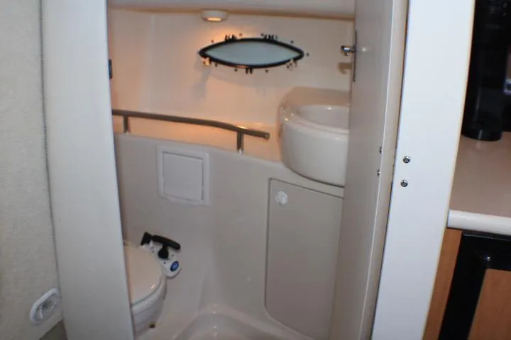 Slide: The Image of Blue and white leaf-patterned fabric on a 2002 Bayliner 3055 Ciera boat interior. - 50