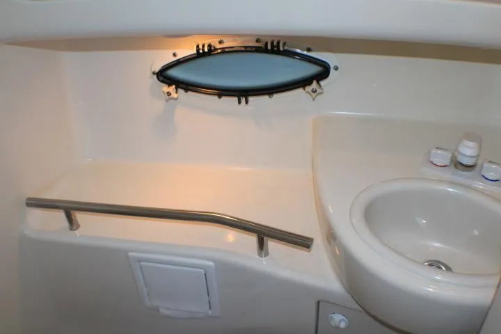 Slide: The Image of 2002 Bayliner 3055 Ciera boat bathroom with toilet and sink. - 52