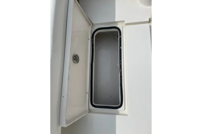 Slide: The Image of Open storage compartment on 2021 Dorado Flatdeck boat. - 13