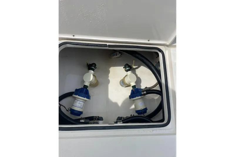 Slide: The Image of 2021 Dorado Flatdeck compartment with hoses and filters. - 14