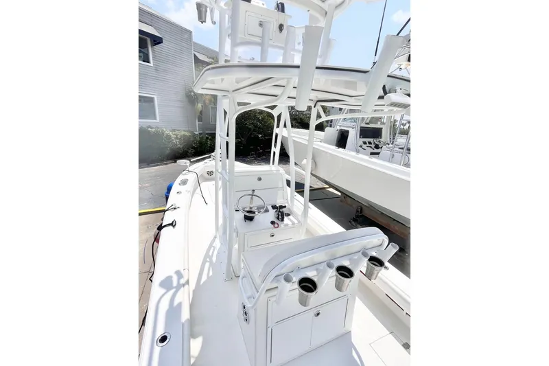 Slide: The Image of 2021 Dorado Flatdeck boat with white interior and fishing rod holders. - 4