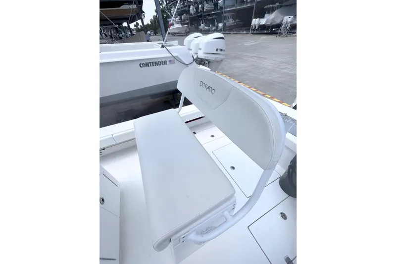 Slide: The Image of 2021 Dorado Flatdeck boat with white seating and visible Yamaha engine. - 7