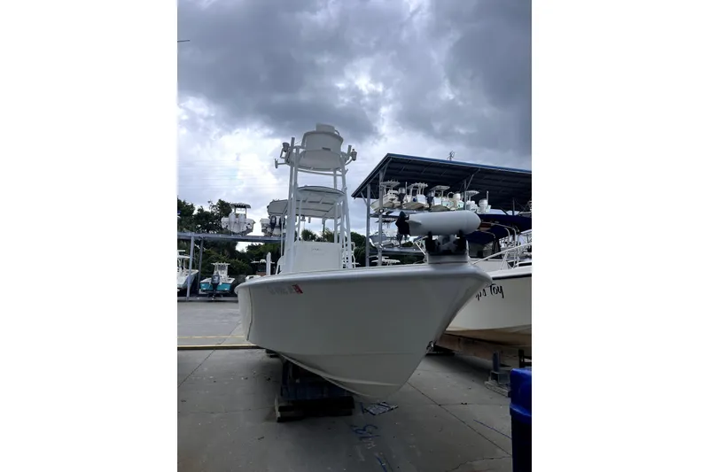 Slide: The Image of 2021 Dorado Flatdeck boat in marina under cloudy sky. - 9
