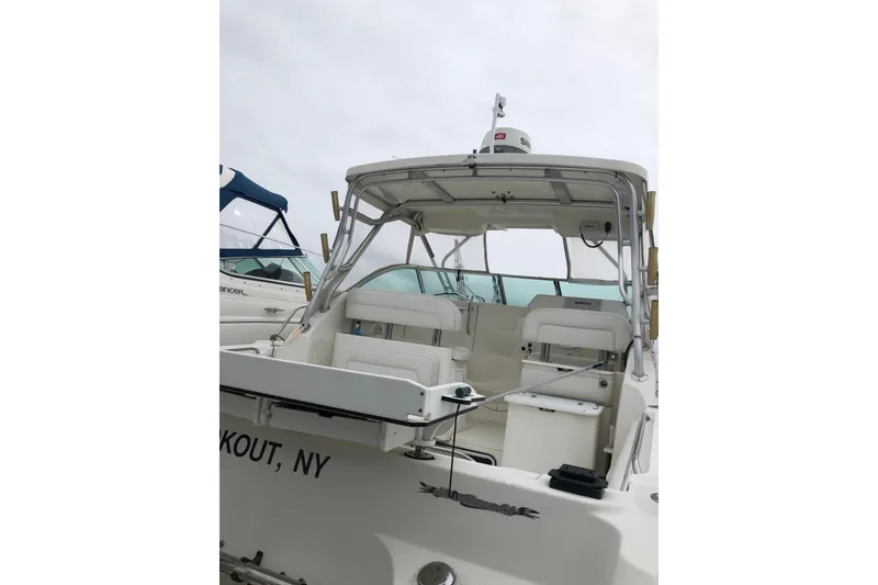 Slide: The Image of 2004 Wellcraft 290 Coastal boat with seating, docked in New York. - 3