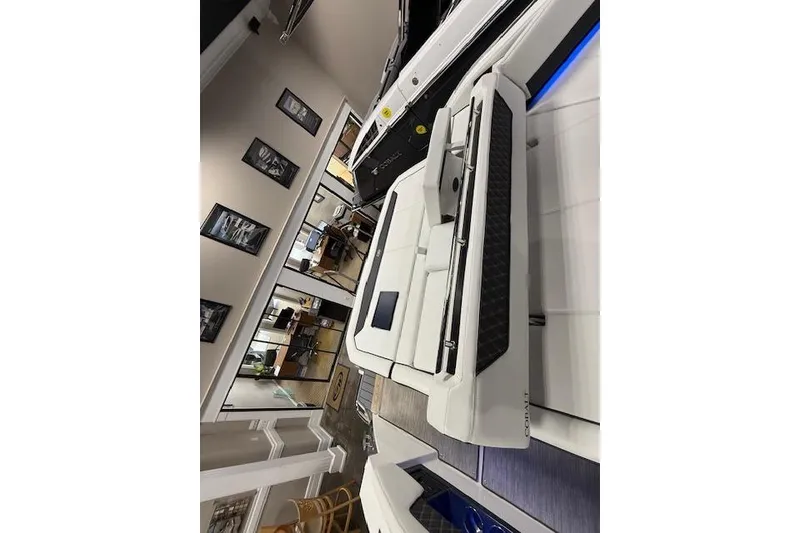 Slide: The Image of 2025 Cobalt R35 boat interior with luxurious white seating and modern design. - 10