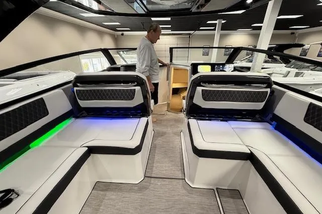 Slide: The Image of 2025 Cobalt R35 boat interior with modern seating and ambient lighting. - 4