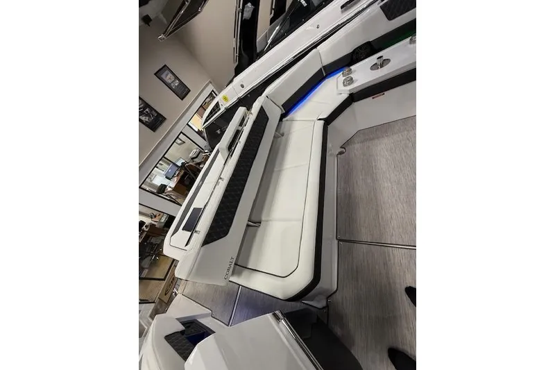 Slide: The Image of 2025 Cobalt R35 boat interior with white seating and modern design. - 9