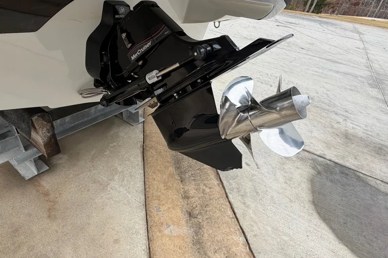 Slide: The Image of 2022 Crownline 240 SS boat with MerCruiser outdrive and stainless steel propeller. - 15