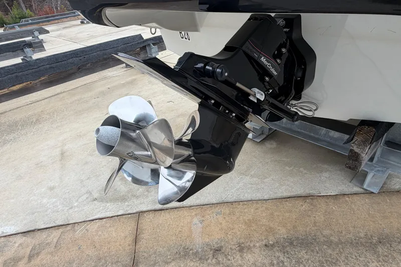 Slide: The Image of 2022 Crownline 240 SS boat with a Mercury MerCruiser outdrive and stainless steel propeller. - 16
