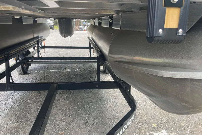 Slide: The Image of Underneath view of a 2014 Sun Tracker Party Barge 18 DLX on a trailer. - 3