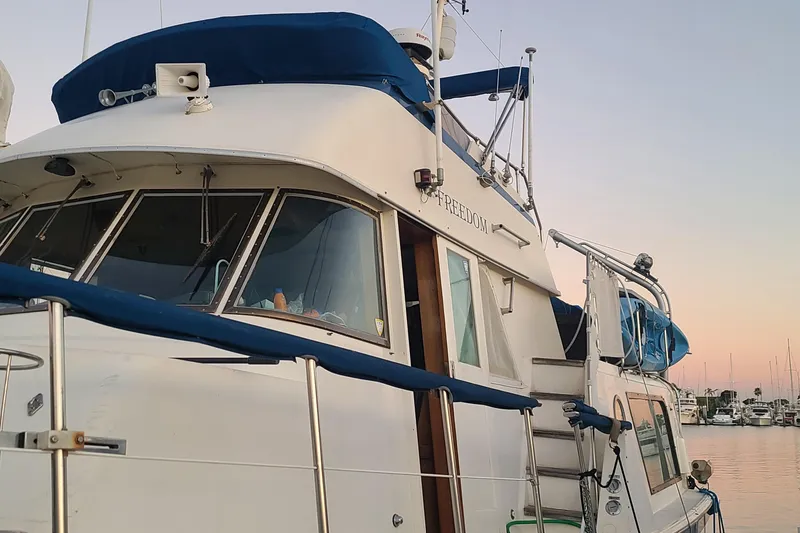 Slide: The Image of 1976 Hatteras 48 Long Range Cruiser deck with equipment and railing. - 10