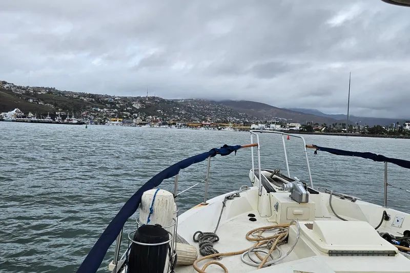 Slide: The Image of Interior staircase of 1976 Hatteras 48 Long Range Cruiser with wooden paneling. - 12