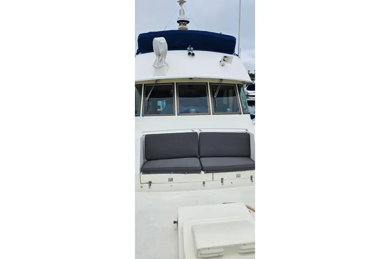 Slide: The Image of Interior of 1976 Hatteras 48 Long Range Cruiser with wood paneling and cozy sleeping quarters. - 13