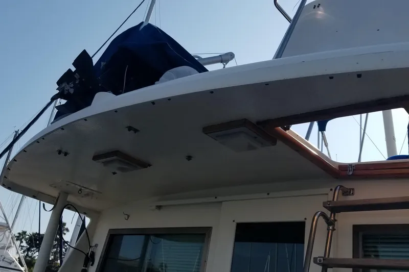 Slide: The Image of Engine room of 1976 Hatteras 48 Long Range Cruiser with equipment and tools. - 19