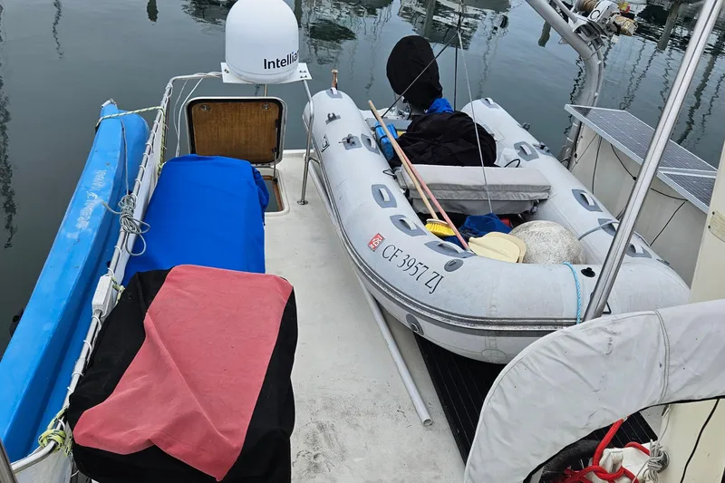 Slide: The Image of Engine room of a 1976 Hatteras 48 Long Range Cruiser with red machinery. - 23