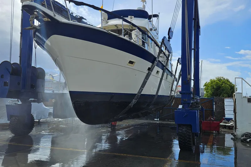 Slide: The Image of Dashboard of a 1976 Hatteras 48 Long Range Cruiser with gauges and navigation equipment. - 29