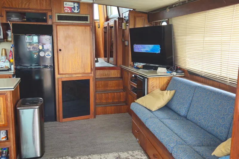 Slide: The Image of Laundry area with storage shelves on a 1976 Hatteras 48 Long Range Cruiser. - 31