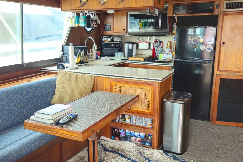 Slide: The Image of Interior of 1976 Hatteras 48 Long Range Cruiser with kitchen and dining area. - 32