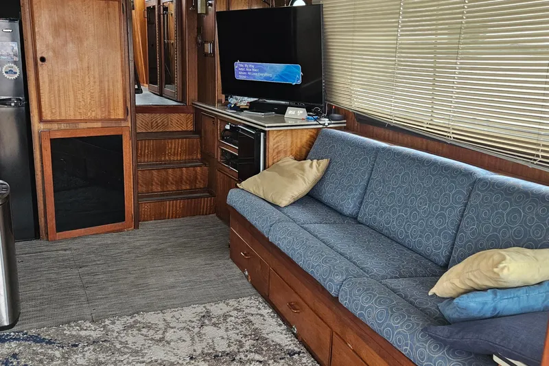 Slide: The Image of 1976 Hatteras 48 Long Range Cruiser with inflatable dinghy on deck. - 33