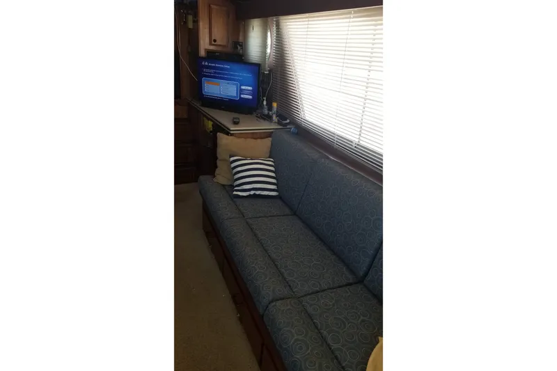 Slide: The Image of Radar equipment on a 1976 Hatteras 48 Long Range Cruiser against a clear blue sky. - 35