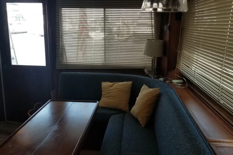 Slide: The Image of Interior of 1976 Hatteras 48 Long Range Cruiser with wood paneling and security monitor. - 42
