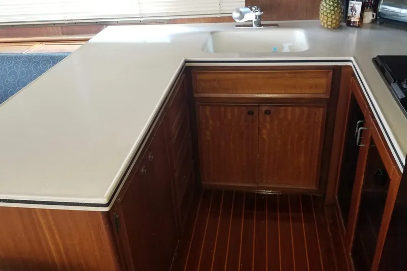 Slide: The Image of Interior of 1976 Hatteras 48 Long Range Cruiser with cozy seating and nautical decor. - 45