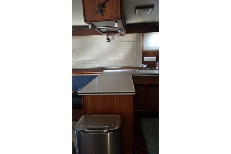 Slide: The Image of Cozy cabin interior of 1976 Hatteras 48 Long Range Cruiser with nautical decor. - 50