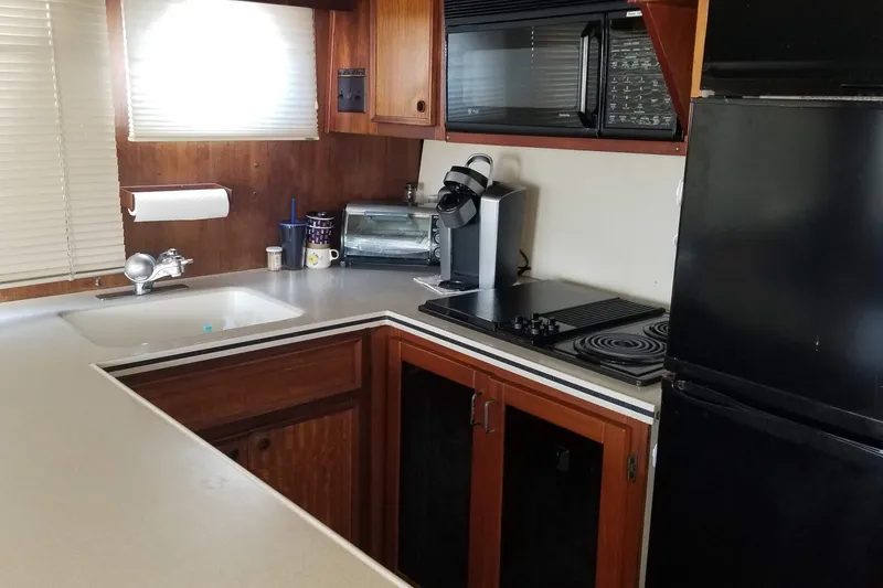 Slide: The Image of Bathroom interior of 1976 Hatteras 48 Long Range Cruiser with sink and shower. - 51