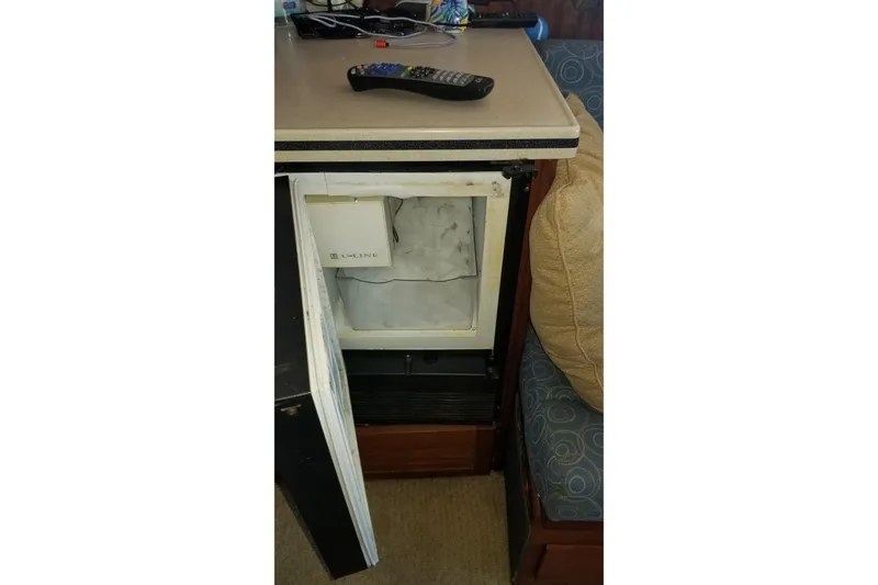 Slide: The Image of Interior view of 1976 Hatteras 48 Long Range Cruiser with wooden doors and cozy cabin. - 52