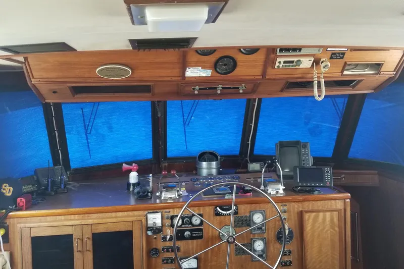 Slide: The Image of Interior of 1976 Hatteras 48 Long Range Cruiser with wood paneling and bunk beds. - 54